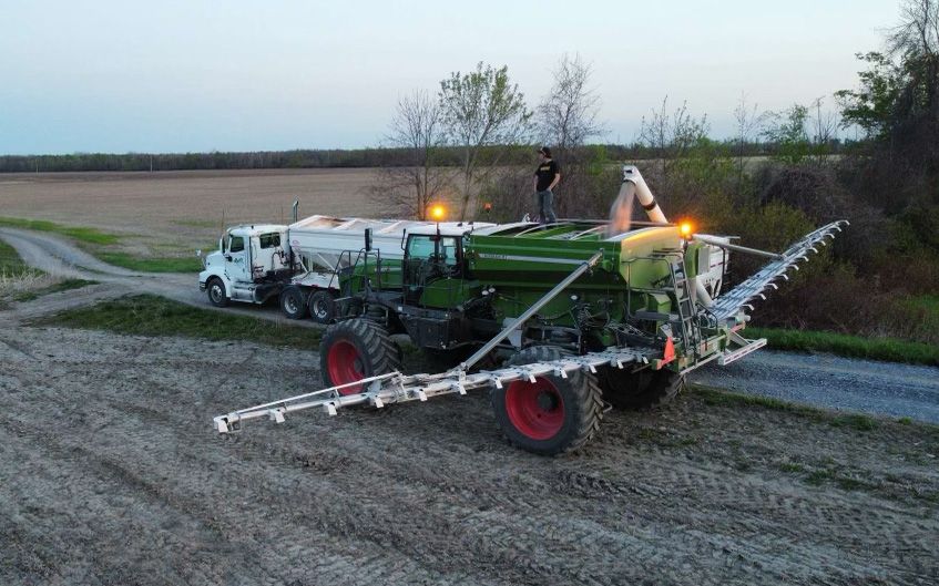 Munro Agromart employees working with equipment at the crops