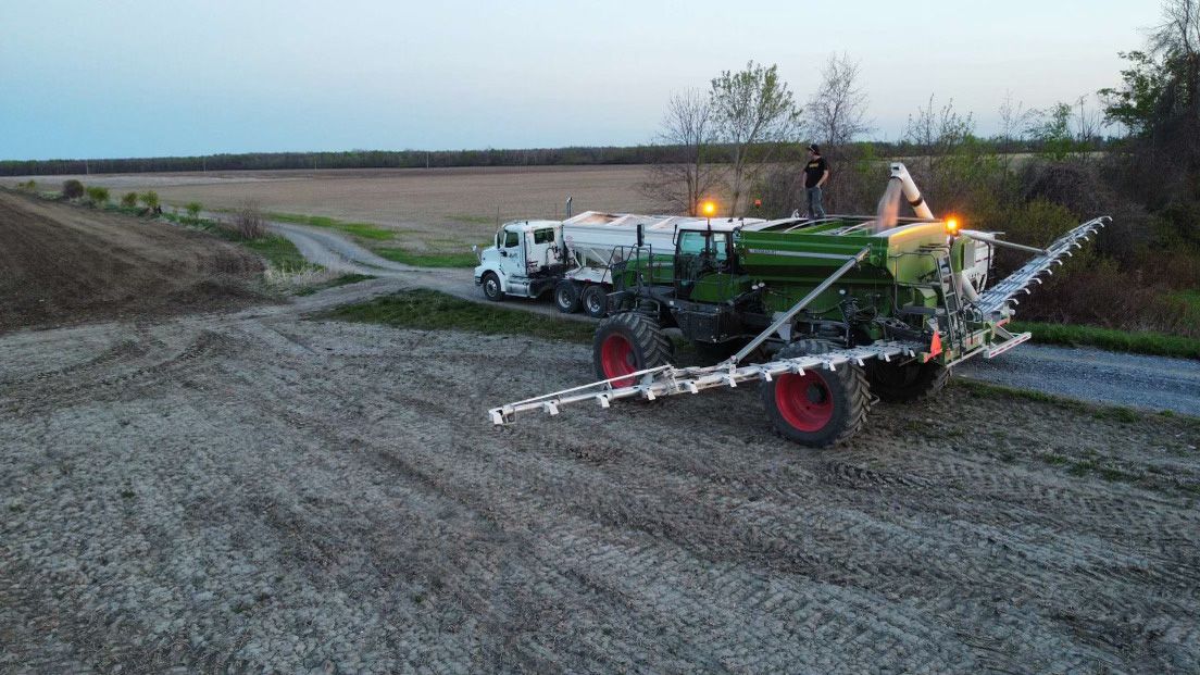 Munro Agromart employees and equipment at the crop